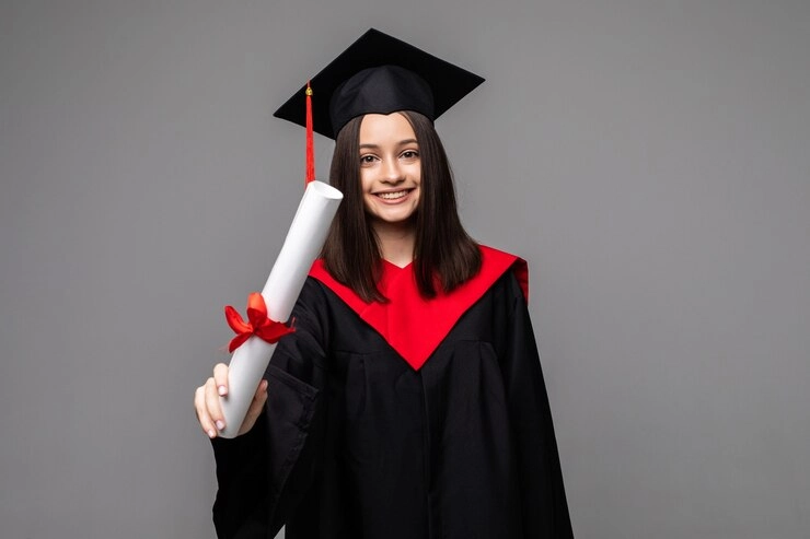 A student celebrating holding degree in hand on a convocation occasion