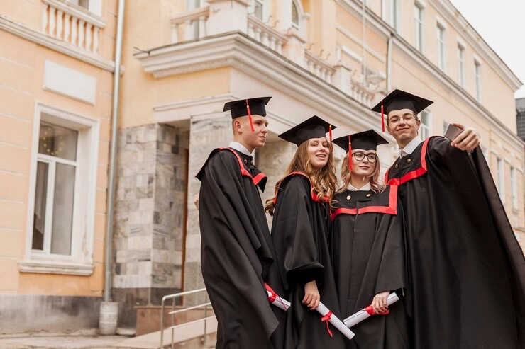Student celebrating holding degree in hand on a convocation occasion